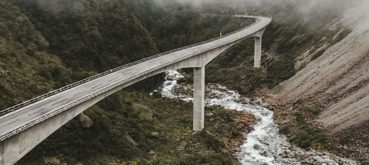 Long concrete viaduct over water at dusk